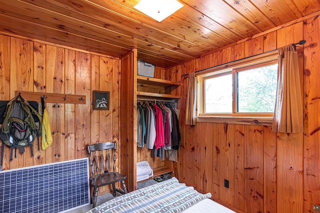 14575 Jackpine Trl, Ely, MN 55731 - carpeted bedroom with wooden walls, a closet, and wood ceiling