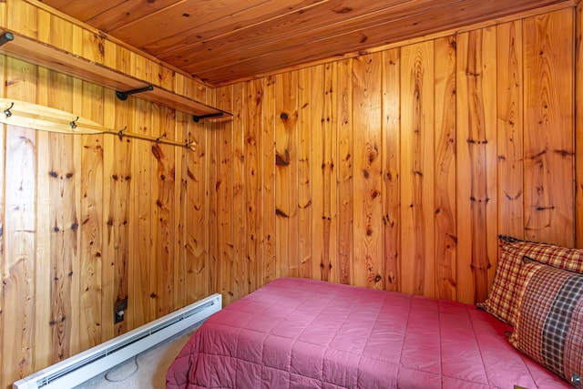 14575 Jackpine Trl, Ely, MN 55731 - bedroom with a baseboard heating unit, wood walls, and wooden ceiling
