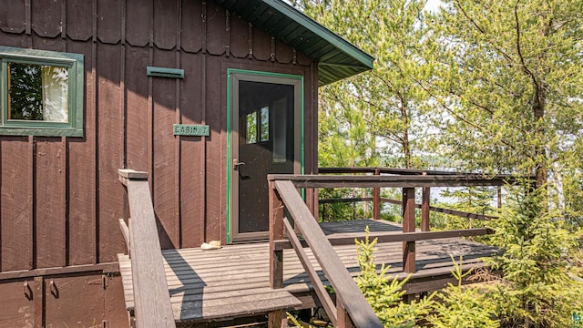 14575 Jackpine Trl, Ely, MN 55731 - property entrance featuring board and batten siding and a wooden deck