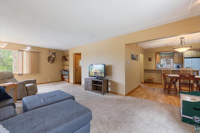 2323 Catskill St, Duluth, MN 55811 - living room featuring light carpet and baseboards