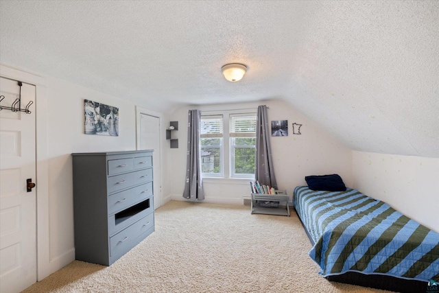2323 Catskill St, Duluth, MN 55811 - carpeted bedroom featuring a textured ceiling and lofted ceiling