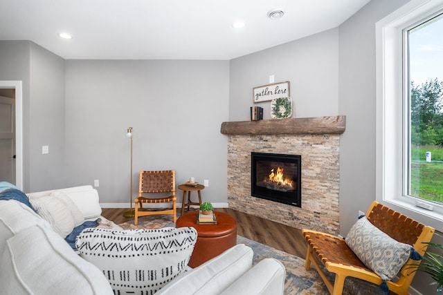 5122 Hermantown Rd Unit 5122, Hermantown, MN 55810 - living area featuring wood finished floors, a stone fireplace, and recessed lighting