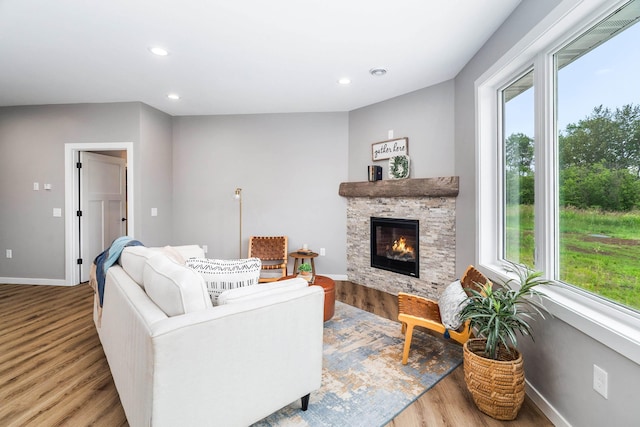 5122 Hermantown Rd Unit 5122, Hermantown, MN 55810 - living area featuring wood finished floors, plenty of natural light, a fireplace, and recessed lighting