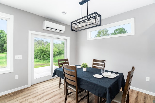 5122 Hermantown Rd Unit 5122, Hermantown, MN 55810 - dining room with a wall mounted AC and light wood-style flooring