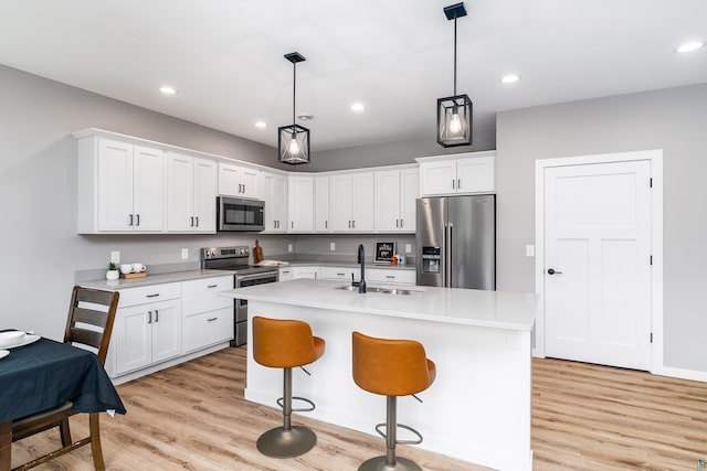 5122 Hermantown Rd Unit 5122, Hermantown, MN 55810 - kitchen with appliances with stainless steel finishes, light wood-type flooring, light countertops, white cabinetry, and recessed lighting
