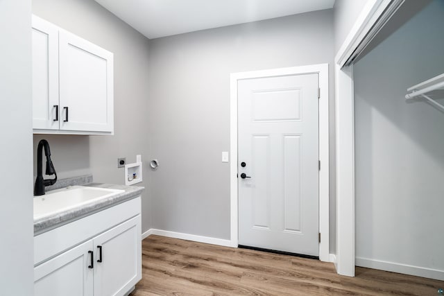 5122 Hermantown Rd Unit 5122, Hermantown, MN 55810 - laundry room with hookup for an electric dryer, light wood-type flooring, cabinet space, and washer hookup