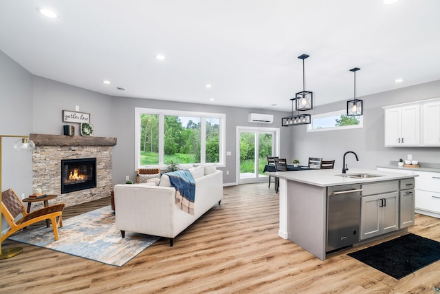 5122 Hermantown Rd Unit 5122, Hermantown, MN 55810 - kitchen featuring dishwasher, open floor plan, light countertops, light wood-style floors, and recessed lighting