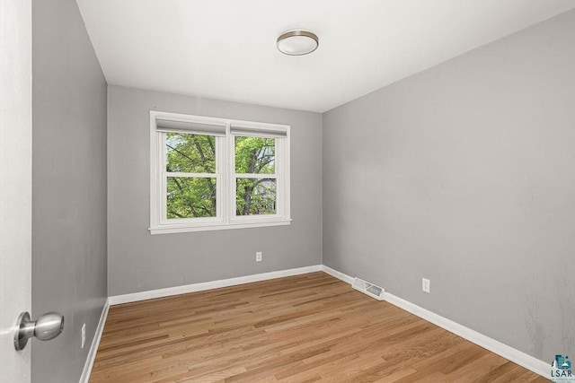 137 Madison Ave Unit 137, Duluth, MN 55811 - spare room with light wood-style flooring and baseboards