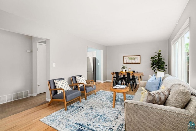 137 Madison Ave Unit 137, Duluth, MN 55811 - living room featuring light wood finished floors and baseboards