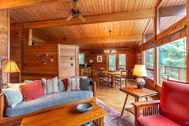 3206 Shady Rst, Ely, MN 55731 - living area with wooden walls, a chandelier, wooden ceiling, wood finished floors, and a ceiling fan