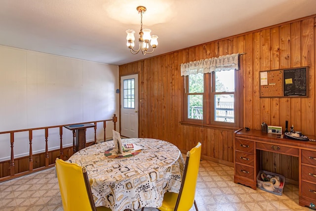 53 Dogwood Blvd, Babbitt, MN 55706 - dining space with light floors, a chandelier, and wood walls