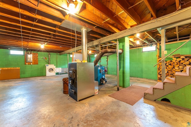 8702 Sock Lake Rd, Babbitt, MN 55706 - below grade area with electric panel, washer / clothes dryer, a heating unit, and healthy amount of natural light