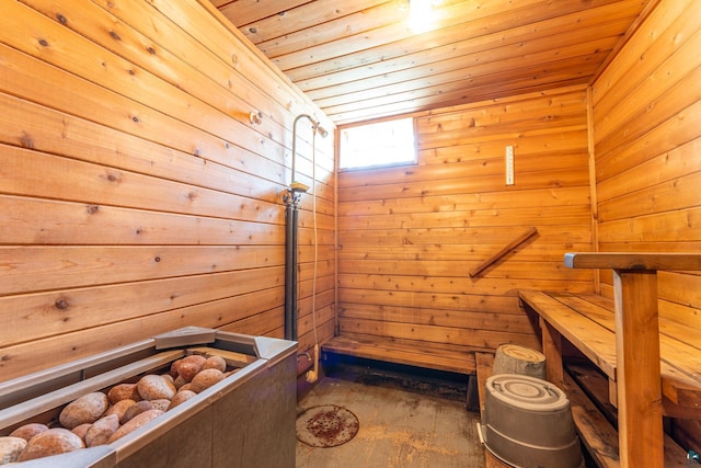 8702 Sock Lake Rd, Babbitt, MN 55706 - sauna / steam room featuring wooden ceiling, wood walls, and concrete flooring