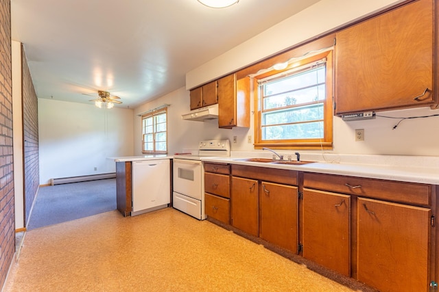 8702 Sock Lake Rd, Babbitt, MN 55706 - kitchen featuring white appliances, under cabinet range hood, brown cabinetry, and a baseboard heating unit