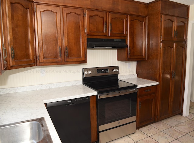 kitchen featuring dishwasher, stainless steel electric range oven, and sink