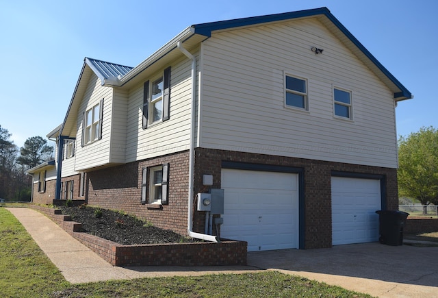 view of side of property with a garage