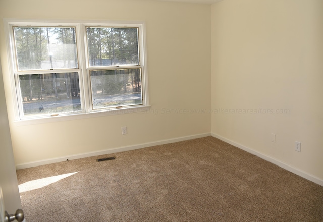 empty room with carpet floors