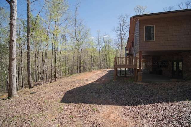 view of yard featuring a wooden deck