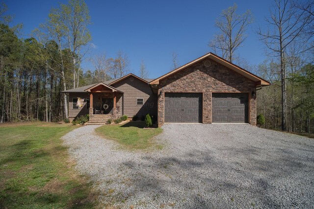 ranch-style house with a front yard and a garage