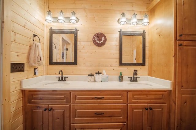 bathroom with vanity and wood walls