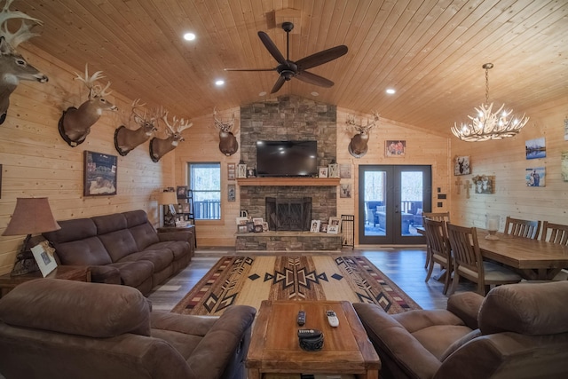 living room featuring french doors, wood ceiling, ceiling fan with notable chandelier, dark wood-type flooring, and lofted ceiling