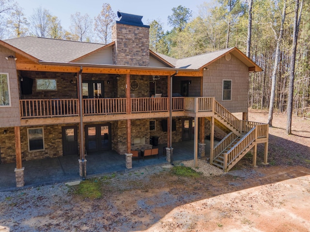 rear view of property with a patio, an outdoor hangout area, and a deck