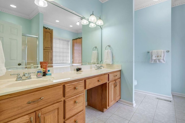 bathroom with double vanity, visible vents, tile patterned flooring, a shower stall, and a sink