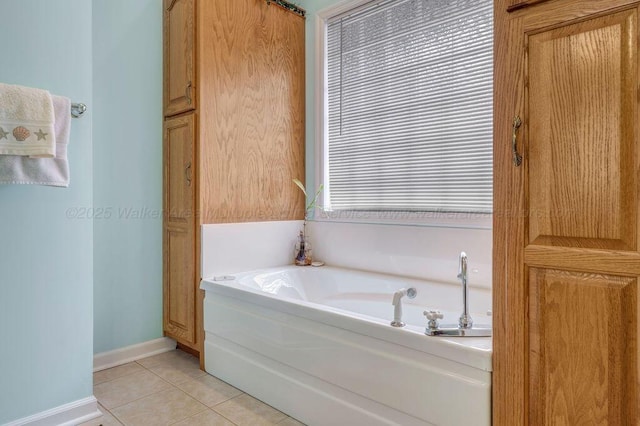 full bathroom with baseboards, a garden tub, and tile patterned floors