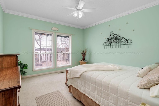 bedroom with visible vents, baseboards, light colored carpet, ceiling fan, and crown molding