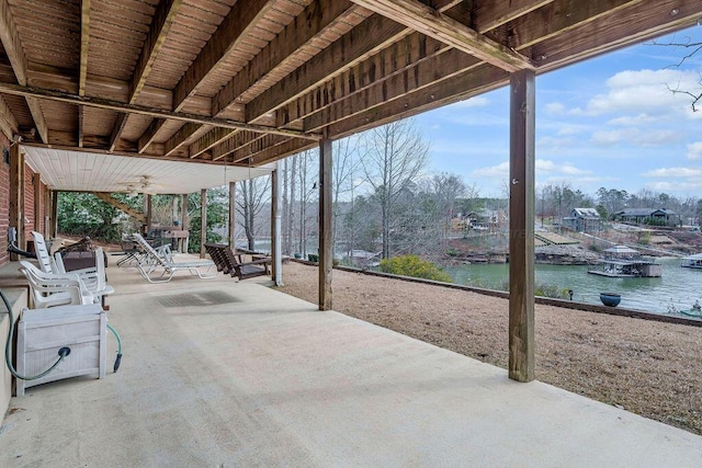 view of patio with a water view