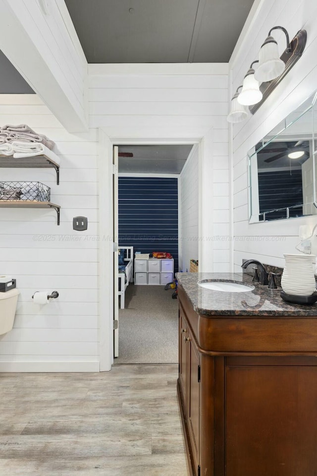 bathroom with vanity and hardwood / wood-style floors