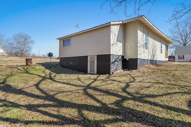 view of property exterior featuring a yard