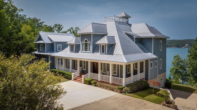 view of front facade featuring a porch and a water view