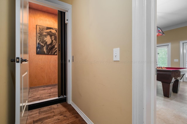 interior space featuring hardwood / wood-style flooring, crown molding, and billiards