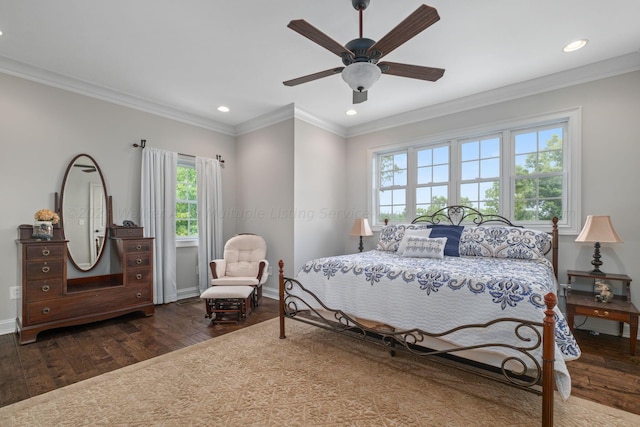 bedroom with multiple windows, ceiling fan, and dark wood-type flooring