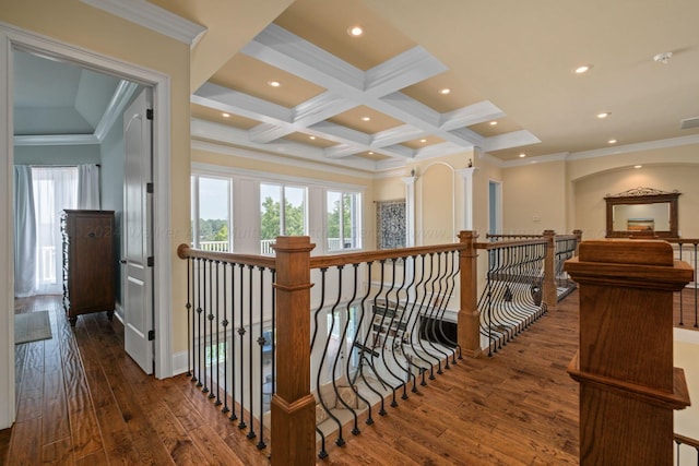 hall with beamed ceiling, ornamental molding, dark wood-type flooring, and coffered ceiling