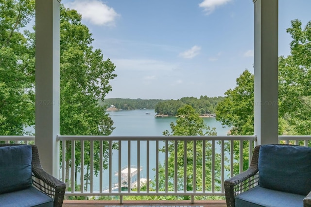 balcony featuring a water view