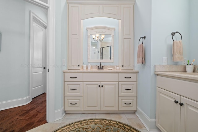 bathroom with hardwood / wood-style floors and vanity