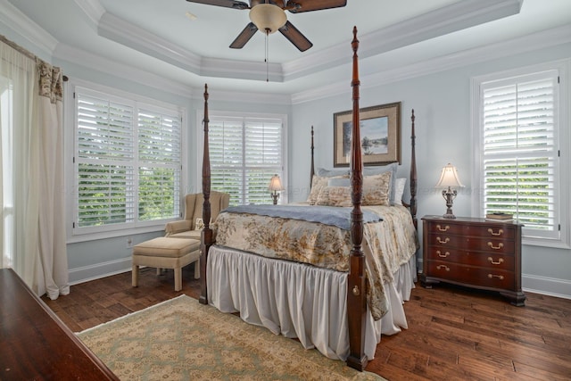 bedroom with multiple windows, ceiling fan, and dark hardwood / wood-style flooring