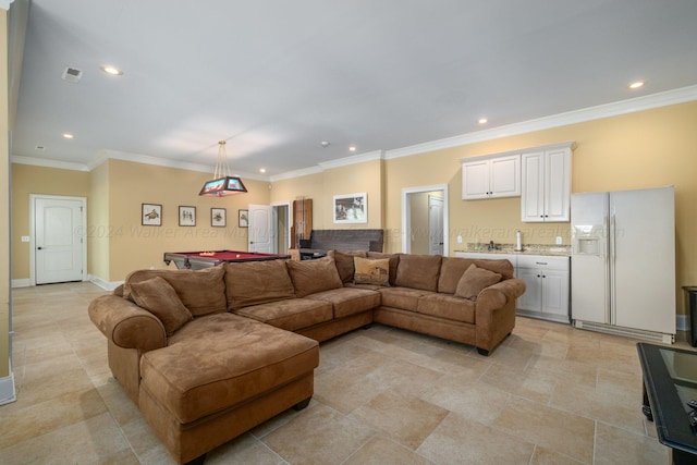 living room with crown molding and pool table