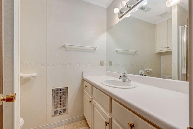 bathroom featuring crown molding, heating unit, vanity, and toilet