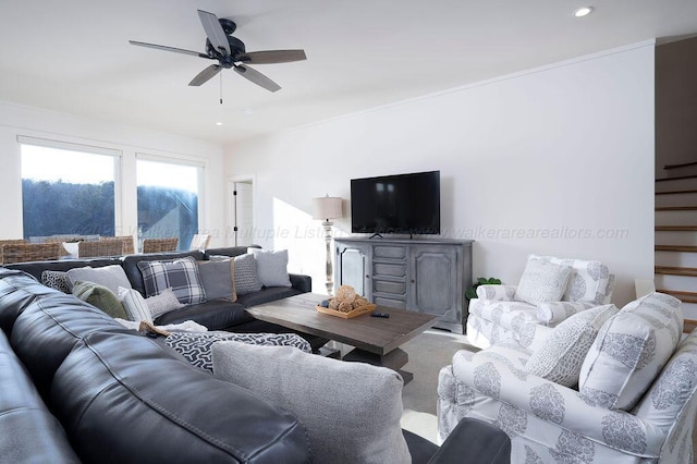 carpeted living room featuring ceiling fan