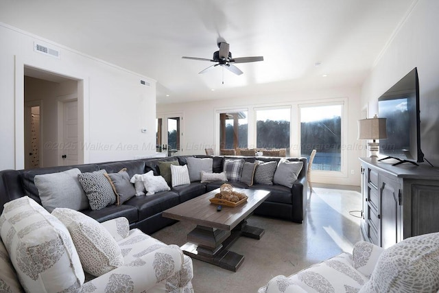 living room featuring ornamental molding and ceiling fan