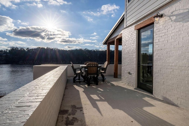 view of patio / terrace with a water view