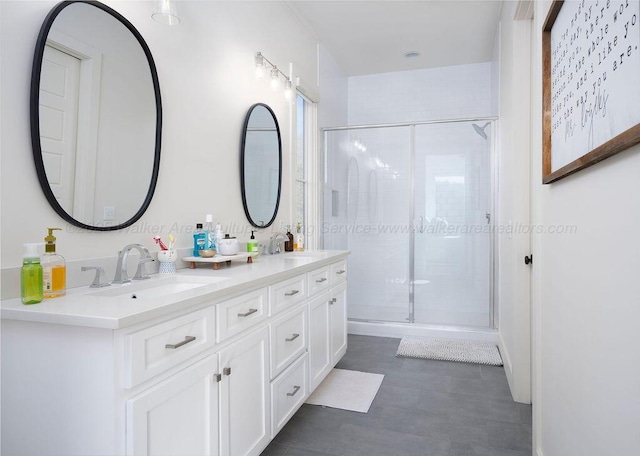 bathroom with vanity and a shower with shower door