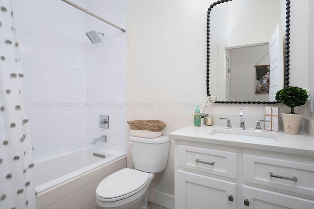 full bathroom with vanity, toilet, and tiled shower / bath combo