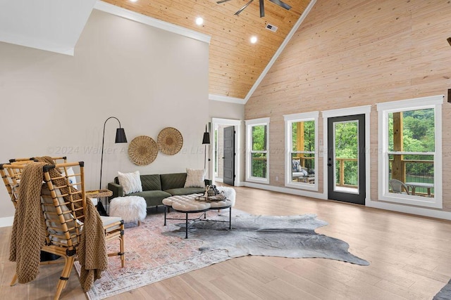 living room with wood ceiling, high vaulted ceiling, ceiling fan, and light hardwood / wood-style flooring