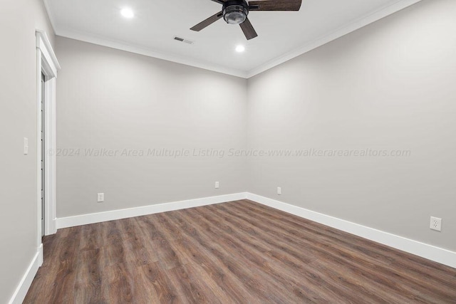 spare room with ceiling fan, dark wood-type flooring, and ornamental molding