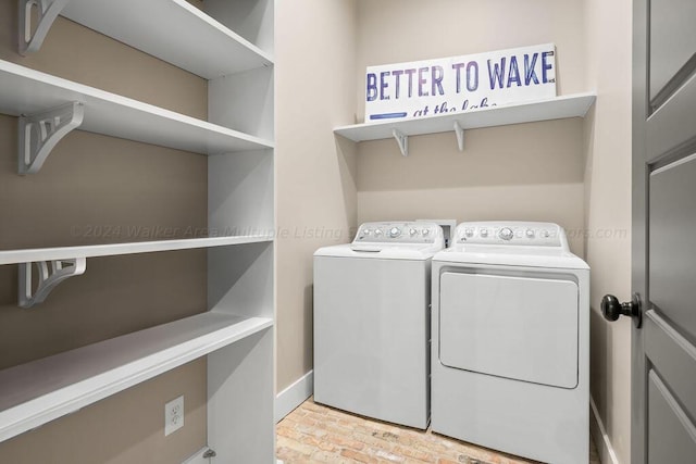 laundry room with washer and dryer