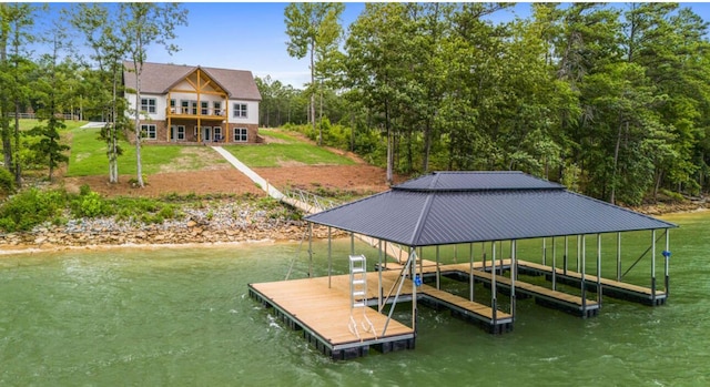 dock area with a yard and a water view